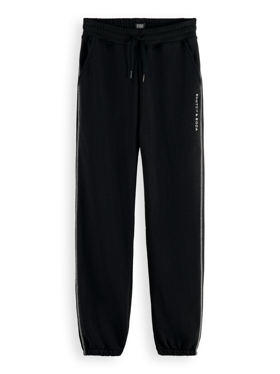essentials — joggingbyxor med avslappnad passform och flatlock-effekt